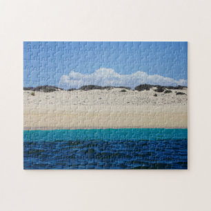 Ocean Waves On Sandy Beach Under Blue Sky Jigsaw Puzzle