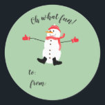 Oh what Fun Christmas Snowman stick on gift tag<br><div class="desc">A cute minimal Christmas design that features a naive digital painting of a snowman wearing matching red hat, scarf and mittens on a sage green background with the text: Oh What Fun! and a place for you to add the giver and recipient names with a sharpie. You can customise the...</div>