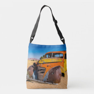 Old and abandoned car in Solitaire, Namibia Crossbody Bag
