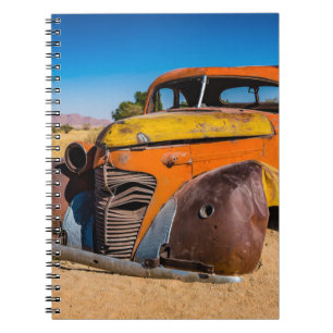 Old and abandoned car in Solitaire, Namibia Notebook