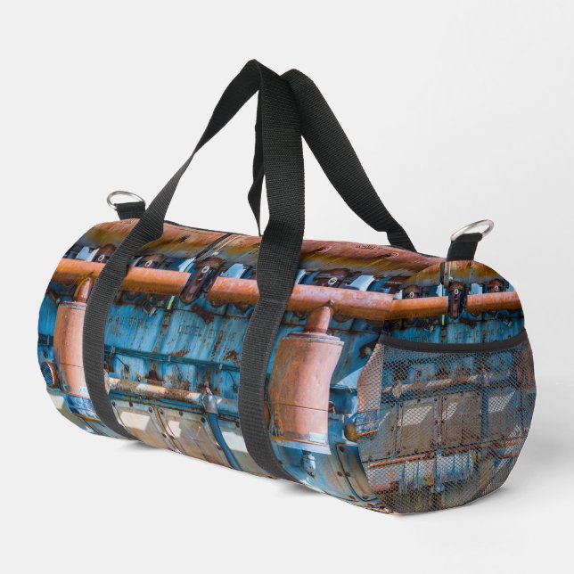 Old and rusty Atlas Imperial diesel engine at Inde Duffle Bag (Right Corner)