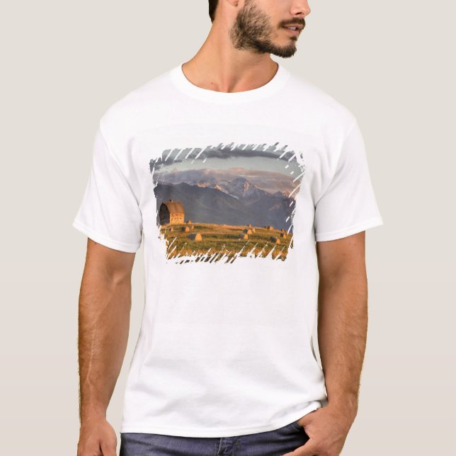 Old barn framed by hay bales and dramatic T-Shirt (Front)