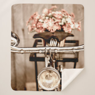 Old bicycle and flowers blur in background process sherpa blanket