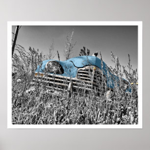 Old Blue Car in Field of Grass Poster