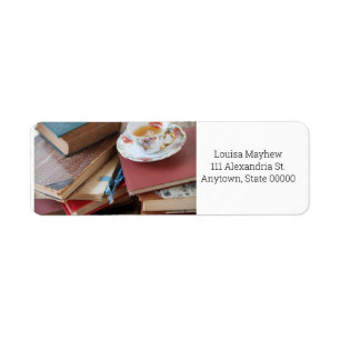 Old books with teacup