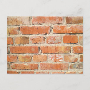 Old brick wall with peeling cladding postcard