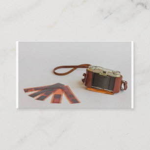 old camera with negative on business card