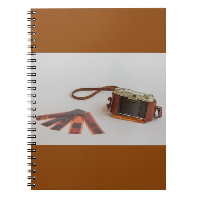 old camera with negative on   photo notebook (Front)