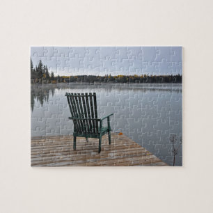Old chair by lake jigsaw puzzle