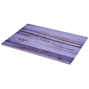 Old cracked purple paint on wood cutting board