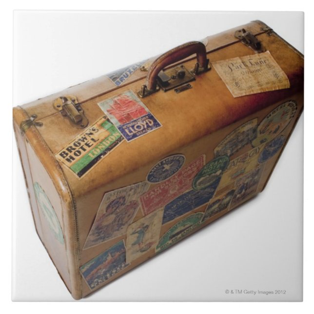 old fashioned suitcase with travel stickers tile (Front)