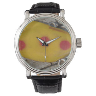 old fishing lure yellow and orange spot watch