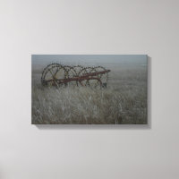 Old hay rake farm equipment in the winter frosty