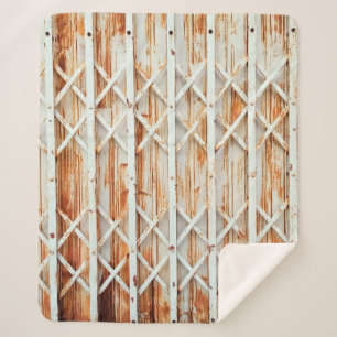 Old iron door panels are rusted. abstract,antique, sherpa blanket