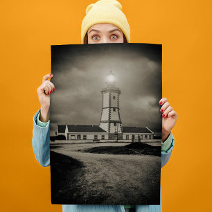 Old lighthouse on a storm night poster