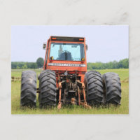 Old Massey Cab Model Tractor In A Field