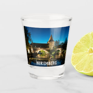 Old medieval bridge at night in Nuremberg Shot Glass