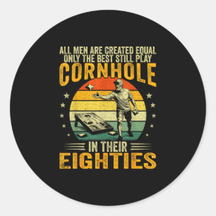 Old men play cornhole in 80s funny bean bag toss classic round sticker