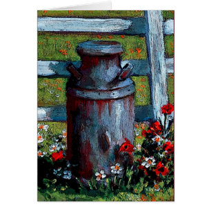 Old Milk Can By White Fence With Flowers
