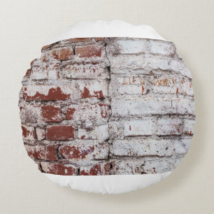Old painted brick wall with peeling white paintwal round cushion