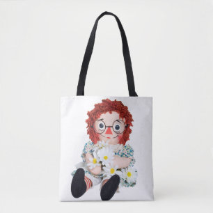 old rag doll with daisy bouquet tote bag