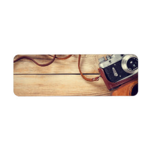 Old Retro Camera On Wooden Table Background