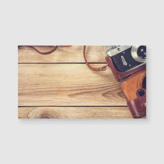 Old Retro Camera On Wooden Table Background