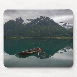 Old rowboat with mountain reflection mousepad