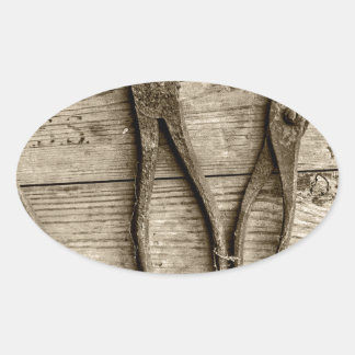 Old rusty tools. oval sticker