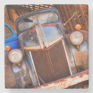 Old rusty truck on a farm stone coaster