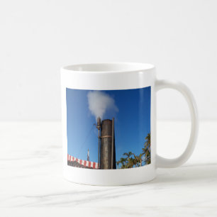 old steam whistle with a white plume of steam coffee mug