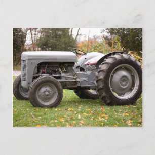 Old tractor in fall postcard