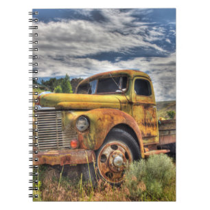 Old truck abandoned in field spiral notebook