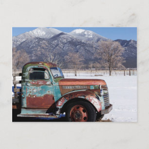 Old truck sitting in the field postcard