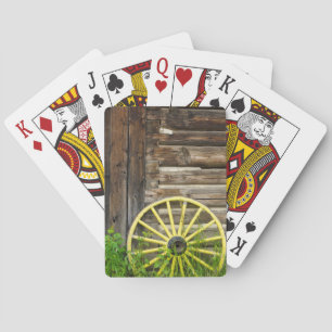 Old wagon wheel in historic old gold town playing cards