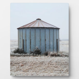 Old Weathered Grain Bin During Winter Time Plaque
