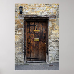Old wooden front door with light poster