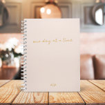 One Day at a Time | Blush Pink and Gold Script Planner<br><div class="desc">An elegant planner with handwritten script informal casual typography in gold "one day at a time" with personalised monogram in gold on a blush pink background. The perfect planner to organise your life!</div>