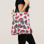 One in a Melon Quote Watermelon Watercolor Pattern Tote Bag<br><div class="desc">This cute and modern fruity foodie pattern is perfect for the summer season. It features a black brushstroke typography quote, "One in a melon, " on top of artsy hand-drawn and hand-patined red, black, white, and green watercolor watermelon fruit pattern. It's fun, playful, and unique! ***IMPORTANT DESIGN NOTE: For any...</div>