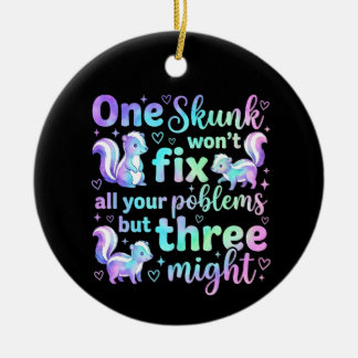 One skunk won't fix all your problems but three  ceramic tree decoration