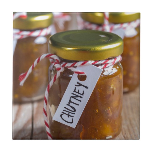 Onion pineapple chutney on rustic wood tile (Front)