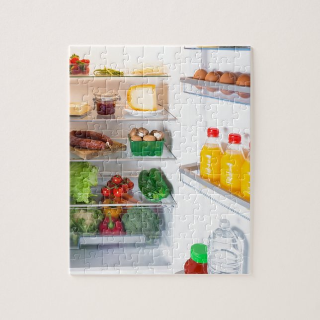 Open fridge filled with food jigsaw puzzle (Vertical)