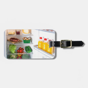 Open fridge filled with food luggage tag