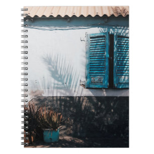 OPENED BLUE LOUVERED WINDOWS NOTEBOOK