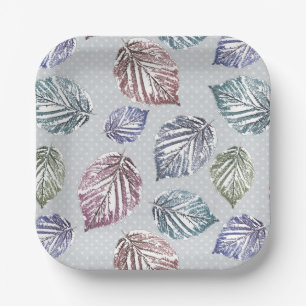 Openwork leaves on a light grey background paper plate