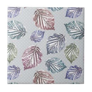 Openwork leaves on a light grey background tile