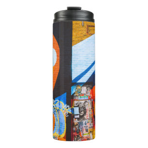 Orange and blue graffiti thermal tumbler