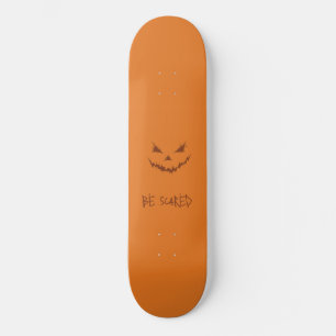 Orange and Scary Carved Pumpkin Face Skateboard