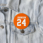 Orange and White Athlete Name Jersey Number 7.5 Cm Round Badge<br><div class="desc">Cheer on your favourite sports team, football player or just show off your school pride with a custom personalised spirit button! Add your school name or personalise with a player's name and jersey number. Perfect for football, basketball, baseball and soccer games! Create custom pins for the whole team, cheerleaders, parents...</div>