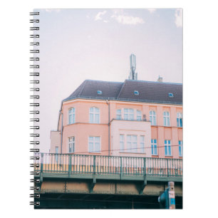 ORANGE AND WHITE CONCRETE BUILDING NOTEBOOK